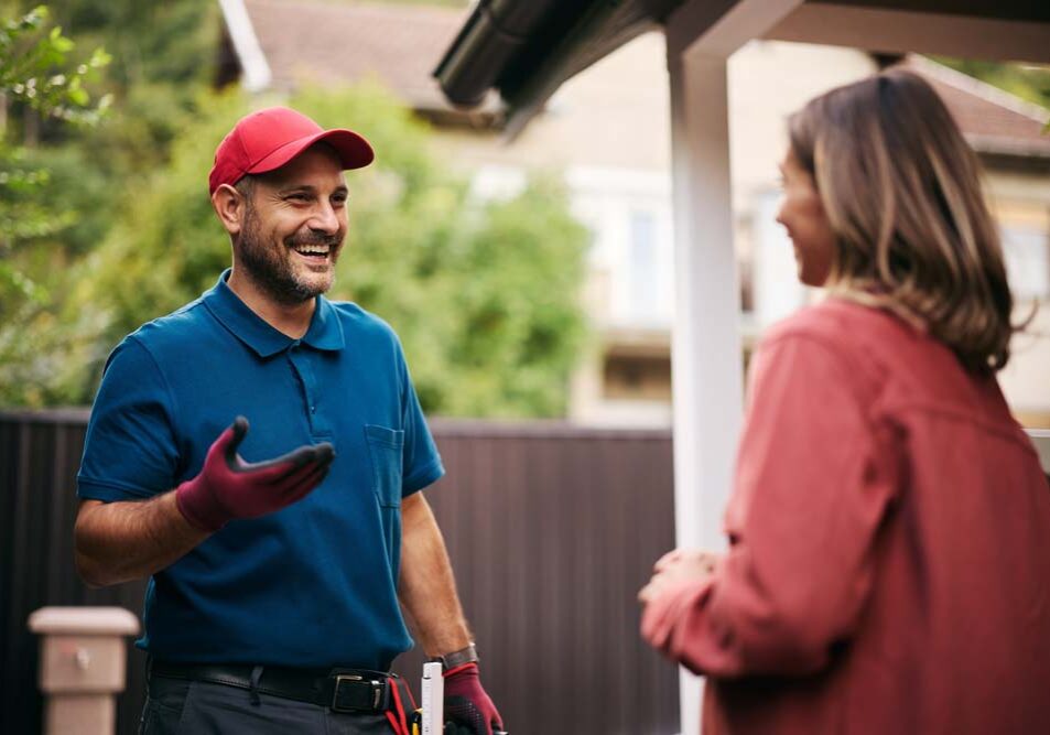 electrician talking to homeowner