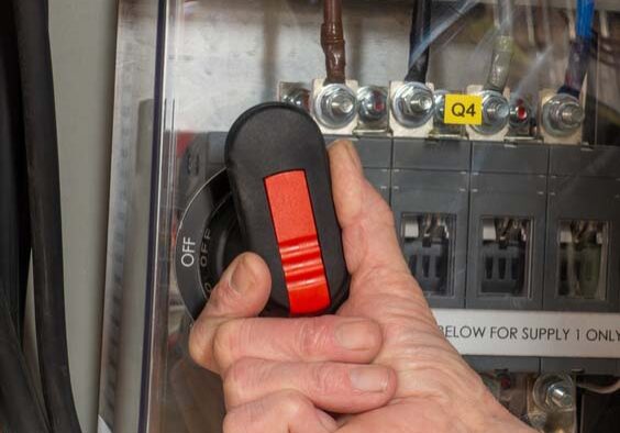 person flipping transfer switch
