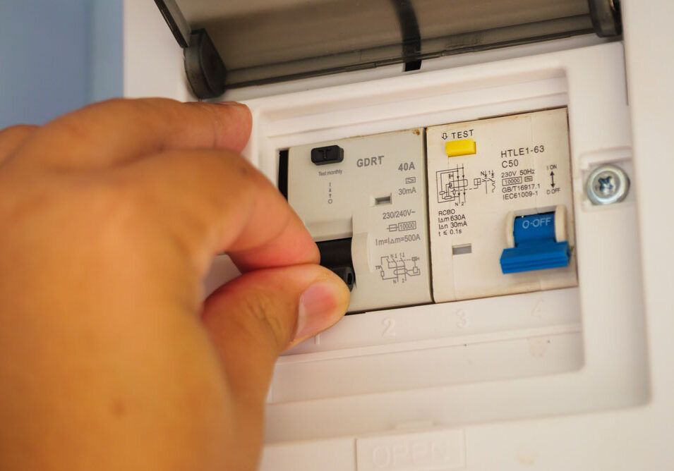 person resetting a breaker